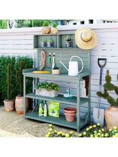 a garden shelf with gardening tools and plants