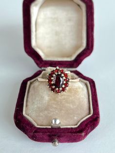 Vintage 9ct yellow gold garnet cluster ring The item comes without the box in the photos, but will be presented in a Gembank1973 gift box. Weight - 3g Ring Size - UK R Measurements - head of ring 12x11 Materials - 9ct gold Hallmarks - Rubbed away - please refer to images Condition - the overall condition is very good Office use - H2 Thanks for looking :) Red Rings Engagement, Vintage Cluster Ring Suitable For Gifts, Yellow Gold Cluster Birthstone Ring Gift, Cluster Yellow Gold Birthstone Ring Gift, Heirloom Cluster Ring Gift, Antique Cluster Ring With Gemstone For Gift, Antique Gemstone Cluster Ring As Gift, Gold Garnet Cluster Ring As Gift, Vintage Cluster Rings For Gifts