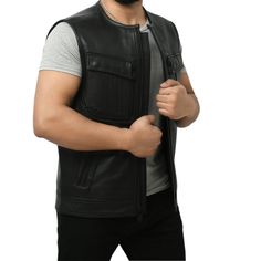 Stowe is made of cowhide leather and includes a back armor pocket for CE level 2 armor. It has two large storage chest pockets deep enough to conceal carry with zipper closure. You can pair this men’s leather vest with a collar with black pants, a black crew-neck t-shirt, and classic blue suede boots. Features: 1.3-1.4mm Platinum Naked Cowhide Leather Back Armor Pocket for our CE level 2 armor. Our patented three zippered easy access system for patches and embroidery. One with zip closure and on Black Vest With Side Pockets, Outdoor Leather Vest With Pockets, Black Leather Vest For Motorcycling, Black Leather Motorcycle Vest, Black Leather Moto Vest, Black Leather Vest With Pockets, Black Biker Vest With Zipper Closure, Black Biker Jacket With Multiple Pockets, Leather Biker Jacket With Multiple Pockets