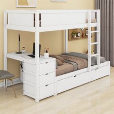 a white bunk bed with drawers underneath it and a computer desk on the bottom shelf