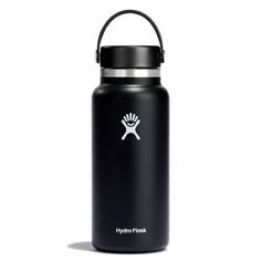 the hydro flask water bottle is black and has a white skull on it's side