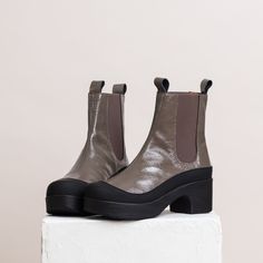 The pull-on Susie Chelsea boot in patent grey leather is the perfect mix of style and function. The patent leather brings a touch of glam to the boot, while the waterproof rubber trim protects from damp and dirt. A removable anatomical insole gives optimal foot support. The Susie Boot is handmade in Portugal. Soft, light & bendable sole Handmade in Portugal Heel height 5,5 cm /2,16 in Shaft height 15 cm /5,9 in True to size Soft Boots, Womens Booties, Clog Boots, Heel Grips, Shoes Too Big, Booties Ankle Boots, Soft Shoes, Slipper Shoes, Chelsea Boot