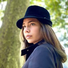 Black trilby hat made with rabbit fur felt velour. Finished with a ribbon of the same felt with a small and beautiful silver buckle. This stylized hat is one of my favourite handmade piece with a beautiful silhouette. The hat has the characteristic of a male hat, but is perfectly suitable for women. The measurements in centimeters are 25 x 23. Crown hight 10. Brim lengthin front 5. (These measurements may vary slightly depending on the size of the hat) For its elaboration we only use hoods and c Black Fur Felt Top Hat For Winter, Elegant Black Hat Bands For Winter, Black Fur Felt Hat For Kentucky Derby, Black Fur Felt Hats For Party, Winter Black Short Brim Boater Hat, Black Short Brim Boater Hat For Winter, Black Fur Felt Fedora For Winter, Elegant Black Fur Felt Cloche Hat, Elegant Black Boater Hat For Winter