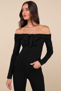 You'll be the center of attention in any room when you're wearing the Lulus Major Charisma Black Off-the-Shoulder Bow Long Sleeve Top! Stretchy ponte knit shapes this flattering top that has long sleeves and an off-the-shoulder neckline with a mesh-style overlay that has tonal velvet polka dots and forms a bow at the front. Fitted bodice continues down to a lightly cropped hem. Fit: This garment fits true to size. Length: Size medium measures 15" from top to bottom. Bust: Great for any cup size. Stretch Knit Top For Evening, Black Stretch Off-shoulder Top In Elastane, Fitted Black Cold Shoulder Top, Fitted Off-shoulder Top For Fall Party, Black Stretch Elastane Off-shoulder Top, Fitted Off-shoulder Knit Top, Fitted Cold Shoulder Off-shoulder Top For Fall, Fitted Cold Shoulder Blouse For Party, Black Off-shoulder Top For Fall Evening