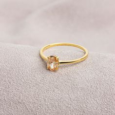 Citrine stone is believed to represent abundance and fertility. Our citrine ring has a stylish design and is suitable for daily use. A nice gift that can make you and your loved ones happy. The birthstone of those born in November is Citrine. F E A T U R E S * Made to Order. * Gold KT: 14K * Gold Color: Yellow Gold, Rose Gold, White Gold * Citrine Carat: 0.70 ct. * Stone Height: 7,00 mm / 0.28 inch * Stone Width: 5,00 mm / 0.20 inch * Setting Type: Bezel Setting * Ready to Ship in 1-3 Business Days * 100% US sourced * 2 Years Warranty * Free Express International Shipping * Free returns within 14 days from the order date Oval Cut 14K Solid Gold Citrine Ring, Mother's Day Gift, 14K Gold Birthstone Ring, Oval Cut Citrine Ring, Women's Jewelry, Minimalist Ring We loved making our jewelry with Promise Ring With Citrine Birthstone, Citrine Birthstone Ring With Gemstone For Promise, Citrine Gemstone Birthstone Ring For Promise, Morganite Topaz Ring In Yellow Gold, Gold Diamond Morganite Ring With Gemstone, Promise Citrine Birthstone Ring, Topaz Crystal Promise Ring, Gold Crystal Ring With Topaz Birthstone, Gold Morganite Diamond Ring With Gemstone