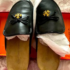 New Tori Burch Black Charm Mules. So Very Comfortable. Nib With Packing And Protection Bag With Matching Charm. Suede Insole. Tory Burch Mules, Black Flat Leather Shoes, Tory Burch Slides, Tory Burch Black Sandals, Tori Burch Sandals Black, Tori Burch, Protection Bag, Black Leather Ballet Flats, Tory Burch Ballet Flats