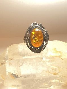 Amber ring floral sterling silver womenSize  8Weight   5.2g  Length     1"Width.       5/8"Thinnest part of band    1/8"Free Shipping & Free Postal Insurance Delivered in a Gift Box If you do not want the ring polished and want to leave the natural patina please let me know at the time of purchase as I do polish rings before I ship rings out. ThanksFree First Class shipping and postal insurance is included. If you want to upgrade to priority kindly pay an additional fee to do so.  This is re Moon And Star Ring, Amber Ring, Star Ring, Sterling Silver Bands, Clover Leaf, Silver Band, Rings Statement, Diamond Shapes, Floral Art