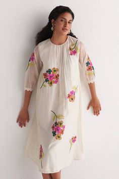 Ivory chanderi woven dress with gathered neckline and floral applique embroidery.
Components: 1
Pattern: Applique embroidered
Type Of Work: Woven, Floral
Neckline: Round
Sleeve Type: Sheer Sleeves
Fabric: Chanderi
Color: Ivory
Other Details: 
Side slits
Occasion: Work - Aza Fashions Spring Chanderi Dress With Floral Embroidery, Spring Embroidered Chanderi Dress With Floral Embroidery, Wedding Dress With Floral Embroidery In Straight Kurta Shape, Wedding Dress With Floral Embroidery And Straight Kurta, Summer Chanderi Embroidered Dress With Floral Details, Spring Chanderi Dress With Chikankari Embroidery, Spring Chikankari Embroidered Chanderi Dress, Summer Chanderi Embroidered Dress With Floral Embroidery, Traditional Off White Dress With Floral Embroidery