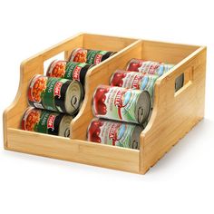 six cans of canned food in a wooden holder