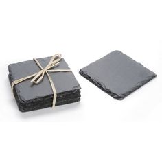 slate coasters tied with twine on white background