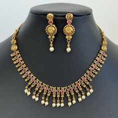 Ruby Gold Necklace Rajwadi South Indian Jewelry Temple Jewelry Guttapusalu Necklace Wedding necklace Bridal necklace Indian Necklace Antique Pearl Necklace With Gold Plating Regular Size And Adjustable, chain closure Handmade Design Antique Necklace Set This is 100% Handmade jewelry. So the color, shades, and texture displayed may vary slightly from the actual product due to digital image limitations. We request you to consider these minor variations. Please expect the possibility of some slight Temple Jewelry Bridal Necklace With Latkans For Marriage, Festive Latkan Necklaces For Marriage, Festive Latkans Necklace For Marriage, Ruby Gold Necklace, Gold Necklace Antique, Bridal Necklace Indian, Antique Pearl Necklace, Guttapusalu Necklace, Temple Necklace