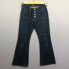 Vintage Japanese Bush Pants Button Fly Blue Wash Jeans Denim - GF30011.  Manual Measurement (laying in flat area):  1) Waist: 28 inch.  2) Rise: 9 inch.  3) Hips: 18 inch.  4) Tight: 10.5 inch.  5) Outseam: 37.5 inch.  6) Inseam: 29 inch.  7) Leg opening: 10 inch.  Fabric Material: 100% Denim Cotton.  Condition: In good vintage condition overall.  Please check all the measurement to insyre a proper fit.  Remember to allow yourself some extra room for movement.  You can compare these information Vintage Flare Jeans With Pockets For Streetwear, Mid-rise Dark Wash Flare Jeans With Buttons, Retro Flare Jeans For Streetwear, 90s Full Length Flare Jeans With Pockets, Spring Jeans With Buttons, Mid-rise Denim Blue Flare Jeans With Buttons, Mid-rise Flare Jeans With Buttons In Denim Blue, High Waist Denim Blue Flare Jeans With Buttons, High Waist Flare Jeans With Buttons In Denim Blue