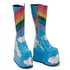 Introducing our new Rainbow Clouds Platform Boots! With a funky rainbow design, these boots will add a pop of color to any outfit. Available in both blue and black options. Step up your shoe game with these unique and playful boots! Material: Microfiber Blue Round Toe Platform Boots For Winter, Blue Winter Platform Boots With Round Toe, Trendy Blue Mid-calf Boots With Round Toe, Multicolor High Ankle Party Boots, Multicolor Round Toe Boots For Party, Multicolor Round Toe Heeled Boots For Party, Trendy Multicolor Party Boots, Retro Knee-high Platform Boots, Blue High-top Platform Boots