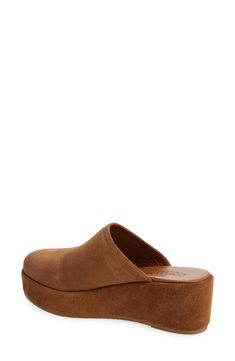 A chunky platform and integrated wedge heel elevate a retro-inspired mule set on a cushioned footbed for lasting comfort. 2" heel; 1" platform Cushioned footbed Leather upper and lining/rubber sole Made in Italy Comfortable Leather Platform Mules, Suede Platform Slip-on Mules, Brown Platform Slippers With Cushioned Footbed And Wedge Heel, Brown Wedge Heel Platform Slippers With Cushioned Footbed, Modern Leather Mules With Arch Support, Comfortable Leather Footbed Mules With Wedge Heel, Comfortable Mules With Cushioned Footbed And Wedge Heel, Modern Platform Slippers With Cushioned Wedge Heel, Modern Platform Slippers With Cushioned Footbed And Wedge Heel