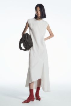 Diaphanous in silhouette, this chalk-white dress speaks to a romantic sensibility. It's crafted from a floaty European Flax™ blend and cut on the bias with a cowl neckline, an asymmetric hem and delicate picot trims. Wear it to events with mules in a contrasting pop colour. Regular fit Concealed zip closure ECOVERO™ is a trademark of Lenzing AG. Viscose fibres are derived from certified renewable wood sources using a lower environmental impact process White Maxi Dress Outfit, Cos Fashion, Pop Colour, Maxi Dress Collection, Maxi Dress Outfit, Summer Dress Outfits, Midi Dress Summer, White Dress Summer, White Maxi