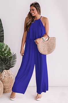 Stay cool in effortless style this summer with our chic blue sleeveless wide leg jumpsuit. Featuring a lightweight fabric and loose fit, this piece ensures you stay cool and comfortable all day long. Perfect for a day on the beach or a night out, you won't ever have to sacrifice comfort for style. 100% Polyester Imported Pull On closure Machine Wash Size Chart XS = Dress 0-2, Bust, 31"-32.5", Waist 23"-24, Hip 31"- 34"Small = Dress 4-6, Bust,33"-35", Waist 25-26", Hips 35"-37"Medium = Dress 8-10 Winter Knit Hats, Chic Pink, Large Dress, Medium Dress, Small Dress, White Sleeveless, Winter Knits, Wide Leg Jumpsuit, Black Sleeveless