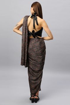 Made of silky soft modal silk, the Amara Sarong is adorned with a hand-printed Ajrakh pattern, this unique piece is your versatile dress for any occasion! This complete wrap and go sarong comes in 2 sizes and is completely adjustable for most sizes and body types. The design features include cascading front pleats with an attached drape for a simple and sophisticated wrap & go dress! Wear it for an afternoon out, at a resort or a cocktail party. The blouse is optional and sold separately. This s Ajrakh Pattern, Saree Fabric, Traditional Attire, Blouse Material, Innovative Fashion, Traditional Sarees, Versatile Dresses, Hand Print, Blouse Fabric