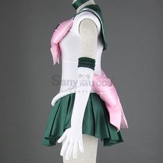 a woman's green and white dress with pink accents