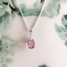 Swarovski Crystal Light Amethyst Pink Dainty Pendant Necklace/Sterling Silver Light Pink Teardrop Necklace/June Birthstone/Birthday Gift for Sister/Present for Friends Classic Swarovski Crystal sterling silver necklace made with a stunning pear cut Swarovski crystal. A gorgeous dainty necklace handcrafted using genuine high quality 11.5mm Swarovski crystal pendant and colour is called Light Amethyst, which is a fabulous sparkly shade of light pink, simply stunning. Comes with a Sterling silver c Sterling Silver Teardrop Birthday Necklaces, Sterling Silver Teardrop Necklace For Birthdays, Sterling Silver Teardrop Necklace For Birthday, Silver Oval Pendant Necklace For Birthday, Birthday Gift For Sister, Bridesmaid Necklace Gift, Dainty Pendant Necklace, White Jewelry Box, Light Amethyst