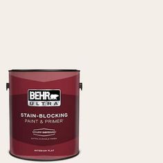 a red paint can with the words behr ultra stain - blocking paint and primer