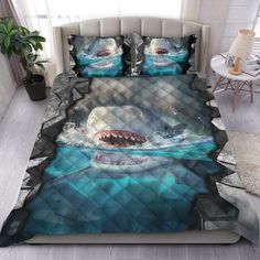 the shark is swimming in the ocean with his mouth open on this bedding set