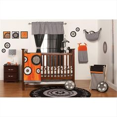 a baby's room decorated in orange and gray