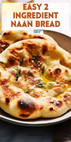 two homemade naan breads on a plate with text overlay that reads easy 2 ingredient naan bread