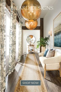 a living room filled with lots of furniture and decor on top of a hard wood floor