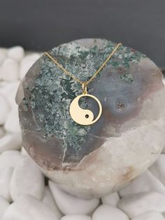 "Yin Yang necklace, ying yang charm, Solid Gold 14k, dainty necklace, delicate necklace, yin yang jewelry, gold coin necklace, disc pendant ♥ Material of pendant and chain: Solid Gold 14k ♥ Packaging: All of our jewelry is beautifully boxed and ready for gifting For more personalized designs take a look here: ♥ www.etsy.com/listing/631444472 ♥ www.etsy.com/listing/645292671 ♥ www.etsy.com/listing/645282627 ♥ www.etsy.com/listing/645285037 ♥ www.etsy.com/listing/645278199 ♥ www.etsy.com/listing/6 Minimalist Round Jewelry For Meditation, 14k Gold Spiritual Coin Necklace With Round Pendant, Symbolic Round Charm Necklace With Coin Pendant, Symbolic Round Charm Necklaces Tarnish Resistant, Symbolic Round Charm Necklace Tarnish Resistant, 14k Gold Circle Necklace With Coin Pendant, 14k Gold Circular Coin Pendant Necklace, Symbolic Round Tarnish-resistant Charm Necklaces, Symbolic Round Necklace With Moon Charm