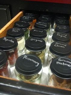 many jars filled with different types of food and seasoning on top of each other