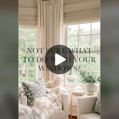 a living room filled with white furniture and lots of window coverings on the windowsill