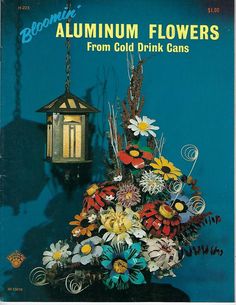 the front cover of bloomin'autumn flowers from cold drink cans, with an image of a hanging lantern