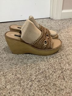 This nice vintage 90s Xhilaration Tan platform Cut out Embroidered wedge platform boho sandals comes to you in a size 8-9. As you can see from the bottom of the heels- gently worn n loved. Pls compare the. Measurements I give you to those in your closet. 70s Wedge Shoes, Brown Wedge Heel Platform Slippers For Beach, Brown Platform Slippers With Cushioned Footbed And Wedge Heel, Brown Wedge Heel Platform Slippers With Cushioned Footbed, Festival Platform Heels With Round Toe, Retro Open Toe Sandals For Beach, Retro Open Toe Sandals For Vacation, Bohemian Platform Wedge Sandals For Summer, Summer Bohemian Platform Wedge Sandals