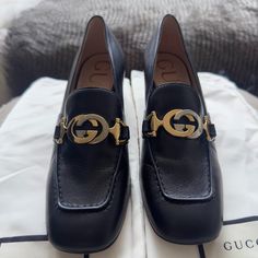 Gucci Malaga Kid Leather Loafer In Black Like-New Gucci Loafer In Clean Black With Iconic Gucci Two-Tone Hardware With Subtle And Elegant Rectangle Toe With A Low Height Heel. Condition: Very Good; Used 1-2x, Some Wear On Soles, No Scuffs Or Marks On Exterior Leather Or Scratches On Hardware. *Size: Us 5 / 35 It/Eu *Heel: 2.5" Approx. *Material: Leather Exterior, Leather Interior *Made In Italy Comes With Original Gucci Silk Shoe Bags. Note: These Are Women’s Loafers, Not Kids, Despite The Name Designer Calf Leather Loafers For Work, Designer Formal Heels With Horsebit Detail, Gucci Black Square Toe Heels, Gucci Leather Sole Evening Loafers, Gucci Evening Loafers With Leather Sole, Black Loafers With Horsebit Detail For Office, Chic Gucci Loafers For Formal Occasions, Chic Gucci Formal Loafers, Black Horsebit Loafers For Office