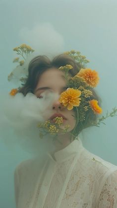 a woman with flowers on her head and clouds in the sky over her face,