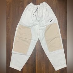 *Womens Size Small * Never Worn Before, Just Missing The Tag *Brand New Condition, No Flaws White Cotton Parachute Pants For Outdoor, Nike Beige Cotton Bottoms, Beige Nike Cotton Bottoms, Nike Casual High Waist Pants, White Cotton Bottoms For Outdoor, Nike Casual Relaxed Fit Parachute Pants, Nike Casual Beige Bottoms, White Sporty Cargo Pants For Outdoor, Sporty White Cargo Pants For Outdoor