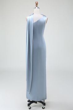 a dress on a mannequin with a light blue draped over it