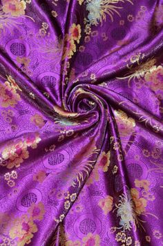 purple and gold floral print fabric