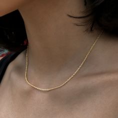 Introducing the Cable Chain Necklace in 18k Yellow Gold. Perfectly delicate and ideal for pairing with any outfit, this piece can be stacked with other necklaces or worn with a small pendant. A must-have for any jewelry collection, this versatile and adjustable cable chain design is your new go-to for everyday wear. This product is guaranteed for life - GLD will repair the item should you experience any defects in craftsmanship or breakage. Specifications - Length: 14"-16" (Adjustable) - Width: Classic Yellow Gold Clavicle Chain Necklace, Classic 14k Gold Chain Necklace At Clavicle Length, Gold Tarnish Resistant Rope Chain Necklace, Classic 14k Gold Clavicle Chain Necklace, Classic Rope Chain Necklace With Delicate Link, Gold Rope Chain Necklace With Figaro Style, Everyday Yellow Gold Adjustable Rope Chain Necklace, Delicate Gold-plated Cable Chain Necklace, Gold Classic Rope Chain Necklace For Everyday