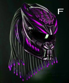 a black and purple helmet with spikes on it's head is lit up in the dark