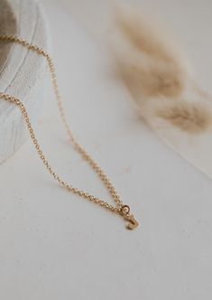 Is there anything sweeter than a tiny single initial? We don’t think so! 8 x 6mm uppercase block letter is suspended from scout chain. Available in 16" or 18". Available in 14kt Gold Fill + Sterling Silver. Kayla layers it with our Pearl Linked Necklace. Handmade in Eau Claire, WI. Our jewelry is handmade so each piece will be unique and may vary slightly from what is pictured. Everyday Tiny Initial Pendant Charm Necklace, Simple 14k Gold Initial Pendant Charm Necklaces, Simple 14k Gold Initial Pendant Charm Necklace, Dainty Tiny Initial Pendant Necklace, Delicate Chain Initial Pendant Necklace, Everyday 14k Gold Filled Initial Pendant Necklace, Everyday 14k Gold Filled Initial Necklace, Everyday 14k Gold-filled Initial Necklace, Initial Pendant Necklace With Cable Chain