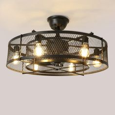 an industrial style ceiling light with four lights