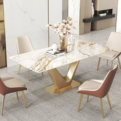 a marble dining table surrounded by beige chairs