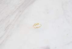 "✦Dainty Gold Infinity Ring! BAND DETAILS ✦Infinity sign is 0.42\"(approx.10.78mm) x 0.18\"(approx.4.79mm) ✦Band's thickness is 0.046\" (inches) or approx. 1.19mm. MATERIALS ✦Available in 9K and 14K and also in Yellow Gold,Rose Gold or White Gold. ✦Ring will be shipped in a jewelry box and bag. ✦IMPORTANT NOTE! All import duties and taxes are the buyer's responsibility, this is not calculated in the price. ✦We ship worldwide with FeDex,so please message us with your telephone number. R E T U R N Handmade Minimalist Infinity Rings, Minimalist Handmade Infinity Rings, Minimalist Infinity Ring As Gift, Minimalist Infinity Rings As Gifts, Simple Gold Ring, Gold Infinity Ring, Geometric Symbols, Karma Necklace, Friendship Symbols