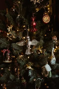 a christmas tree with ornaments hanging from it