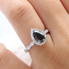 Pear black diamond engagement ring white gold halo diamond band by la more design jewelry Pear Ring Set, Rose Gold Halo Diamond Ring, Black Diamond Halo Ring, Halo Diamond Ring Set, Pear Engagement Ring Halo, Rose Gold Halo Engagement Ring, Black Diamond Engagement Ring, Black Diamond Studs, Pear Diamond Engagement Ring