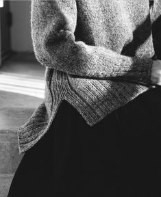 black and white photograph of a woman sitting down