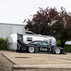 a car that is parked next to a trailer