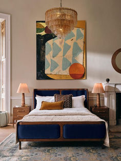 a bedroom with a large painting hanging above the bed