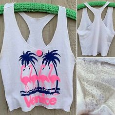 vintage Venice California cropped tank top half shirt flamingos palm trees S (?) | eBay Retro Graphic Print Tank Top For Summer, Pink Cotton Top With Palm Tree Print, Summer Graphic Print Tank Crop Top, Summer Tank Crop Top With Graphic Print, Summer Pink Graphic Print Tank Top, Pink Graphic Print Tank Top For Summer, Summer Printed Crop Top Tank, Printed Sleeveless Crop Top For Beach Season, Sleeveless Printed Crop Top For Summer